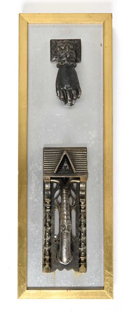 null 165 Panel with two door knockers, one cast iron in the form of a hand, the other...
