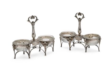 null 129 A pair of silver double saltcellars, the feet decorated with sphinxes, the...
