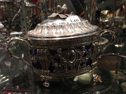 null 140 A silver oval covered sugar bowl and lid standing on four claw feet decorated...