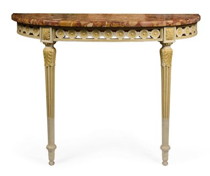 null 246 A carved giltwood half-moon console with a frieze of interlacing motifs...