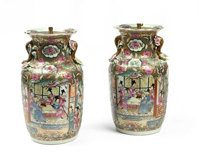 null 194 A pair of Canton porcelain baluster vases with polychrome and gold decoration...