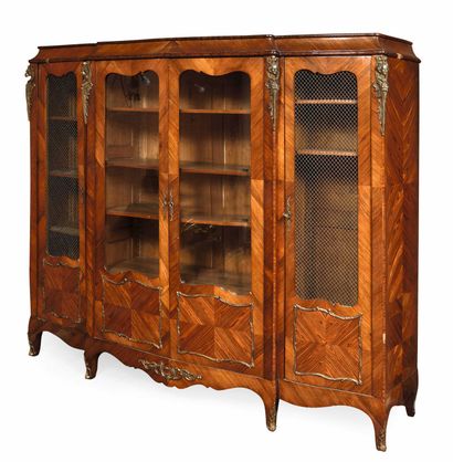 null 285 Large rosewood veneered bookcase in the Louis XV style, decorated with gilded...