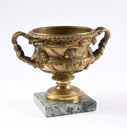 null 287 Attributed to BARBEDIENNE Warwick gilt bronze cup decorated with comedy...