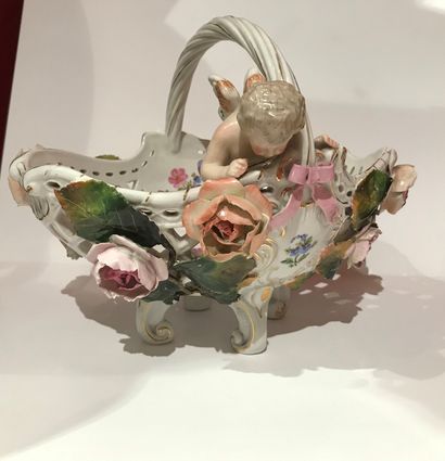 null 131 A polychrome openwork porcelain basket decorated with Cupid and roses in...