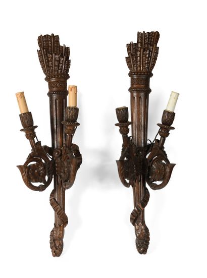 null 283 Pair of two lights sconces in carved wood decorated with quivers. About...