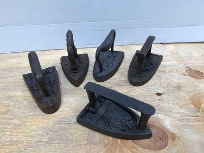 null Ref: 79 Six cast iron irons, all with marks, late 19th century.