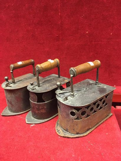 null Ref: 57 Three iron irons, openwork. France, 19th century.