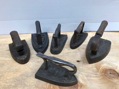 null Ref: 81 Six cast iron irons, four with markings, late 19th century.