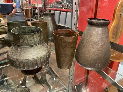 null 
Set of three metal vases with engraved decoration and inscriptions. Oriental...