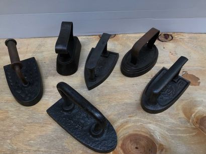 null Ref: 78 Six cast iron irons, four with markings, late 19th century.