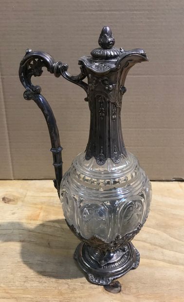 null Cut and engraved crystal ewer, silver setting with foliage decoration.

Marked...