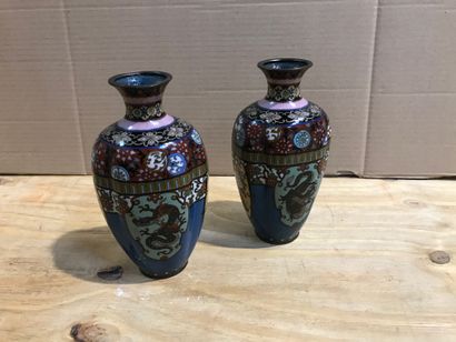 null Pair of cloisonné vases decorated with dragons and flowers in reserves.

Ja...