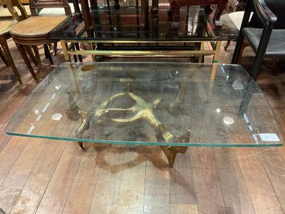 null 
VICTOR ROMAN. Coffee table, the base in gilded bronze, top in glass.

Signed...