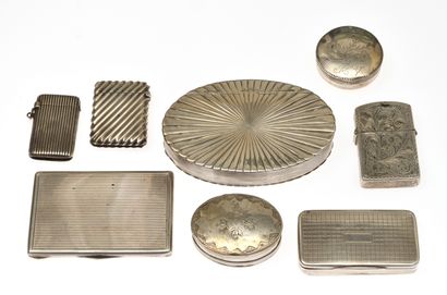 null 8 Set of seven silver boxes, snuffboxes, match holders, lighter and card holders...