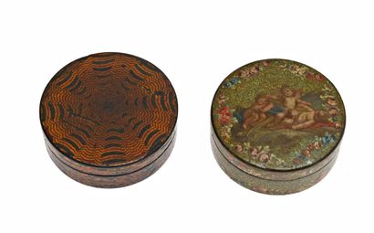 null 13 Two round boxes in tortoiseshell and composition, one decorated with putti...