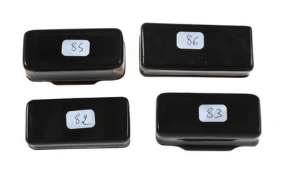 null 28 Four rectangular horn snuffboxes, the hinged lids with geometric decoration...