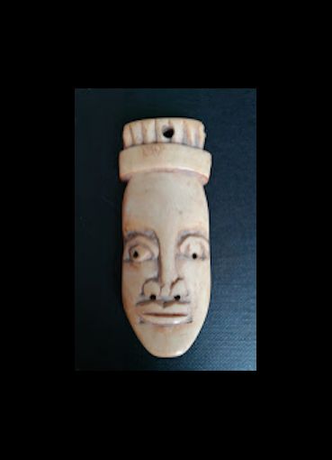 null Passport mask. West Africa. Carved bone. Approx 6/9CM.