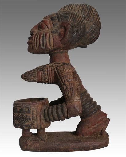 null Africa. Yoruba divination statuette representing a cup bearer (Nigeria). The...