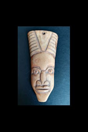 null Passport mask. West Africa. Carved bone. Approx 6/9CM.