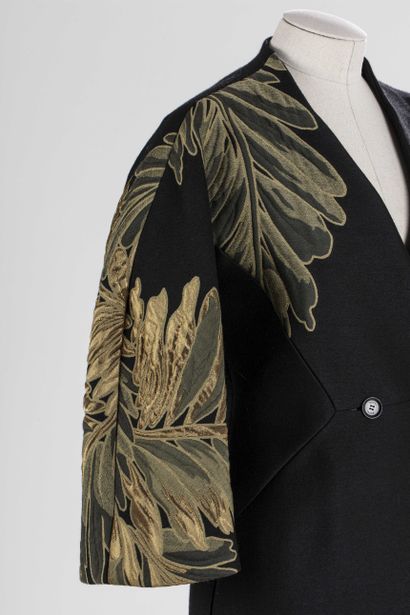 null 
GUCCI: superb coat in black wool with stylized motifs of golden leaves on the...