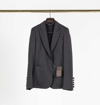 null GUCCI: trouser suit in grey polyester including straight trousers and a jacket...