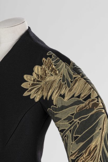 null 
GUCCI: superb coat in black wool with stylized motifs of golden leaves on the...