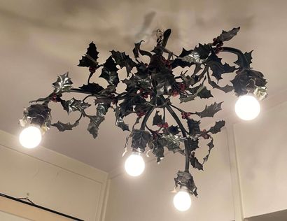 null Metal chandelier with four arms of light, imitating branches of holly.