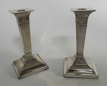 null Pair of candlesticks in silver plated metal of Empire style.