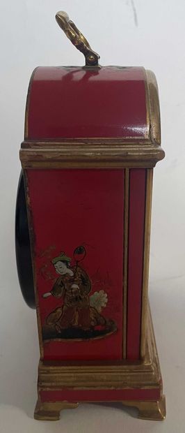 null Chinese clock in red lacquered wood.