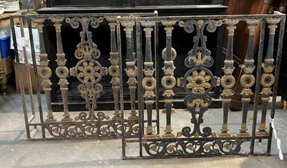 null Two gilded wrought-iron railings decorated with worked and gilded colonnades....
