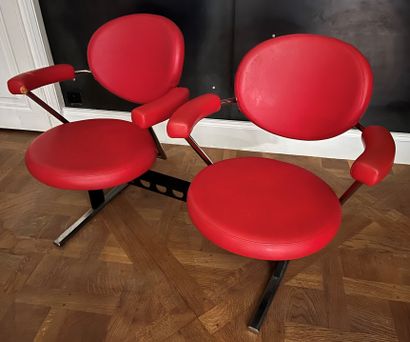 null Pair of hairdressing chairs, tubular metal structure, the seat and back in red...