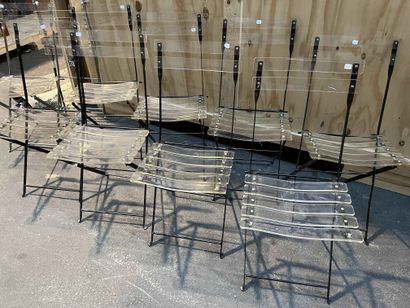 null Suite of eight folding chairs in painted metal and Plexiglas. Two chairs in...