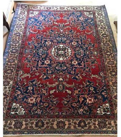 null End Melayer (Iran) around 1950. Wool carpet decorated with a central rose on...