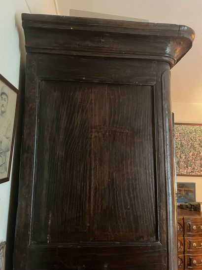 null Chestnut cabinet molded and richly carved with Rocaille decoration. Regional...