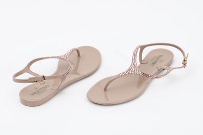 null VALENTINO: nude pvc flip-flop, strap embellished with rhinestones. T. 40
