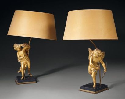 null Paire de lampes, les fûts en bronze ciselé et doré, figurant un Amour et une...