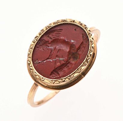 null Ring in yellow gold 18K 750 thousandths decorated with a red hard stone engraved...