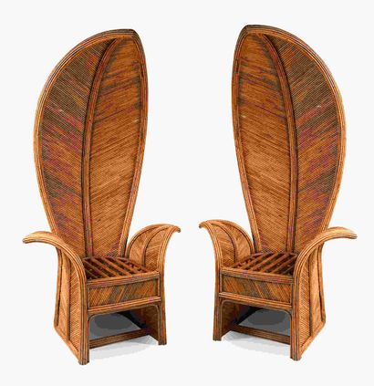 null Pair of large rattan armchairs in the shape of palm leaves and forming a carriage.
194...