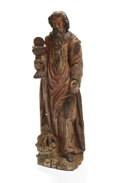 null 183 Saint personnage en chêne sculpté et polychromé, il tient dans sa main un...