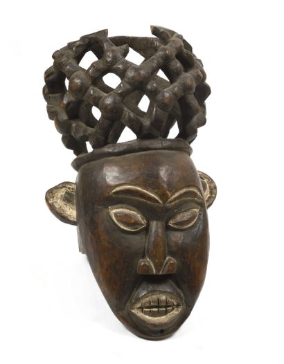 null CAMEROON, Bamoun. Mask in patinated wood decorated with a stylized and openworked...