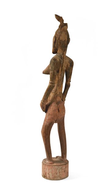 null COTE D IVOIRE, Senoufo. The large Senoufo statues whose feet merge into a cylindrical...