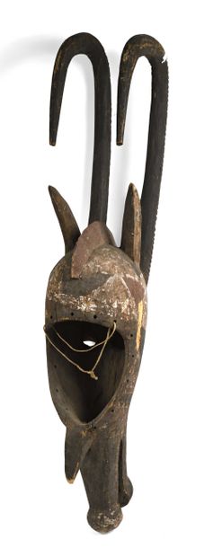 null BURKINA FASSO, Mossi. Helmet mask representing an antelope with long horns curved...