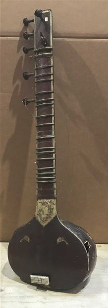 null Wooden stringed instrument, metal and bone, decorated with friezes of foliage....