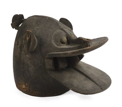 null IVORY COAST, Senoufo. Helmet mask called "fire spitter" representing an animal...