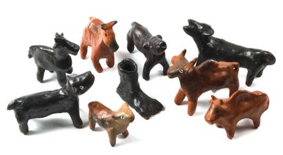 null 148 Eightatuettes representing animals in polychrome clay. Some monogrammed....