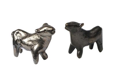 null 150 Two statuettes representing two sheep. Bronze with brown and silver patina....