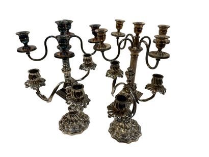 null Pair of silver plated bronze candelabras with rocaille pattern. Two candelabras...