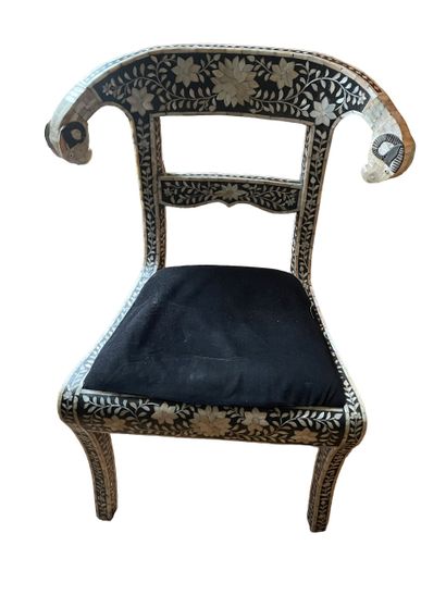 null Chair with mother-of-pearl inlay.
Misses.
