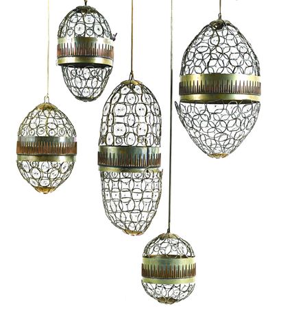 null Suite de cinq lanternes en métal patiné et à décor ajouré « nid d abeille »....