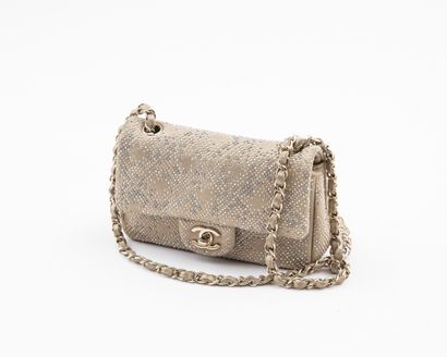 null CHANEL Collection 2012: Small evening bag in gold leather with small cabochons...